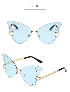 Detail of blue butterfly-shaped frameless lenses with gold metal hollow wing accents