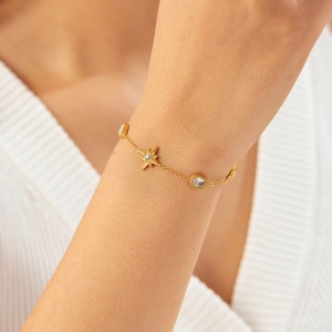 Elegant gold plated stainless steel chain bracelet with star charms and oval diamond accents