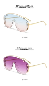 Detail view of large shield sunglasses with gradient lenses and gold metal temples