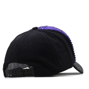 Detail view of the black baseball cap with purple rhinestones and adjustable back strap