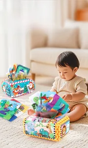 Detail of infant tissue box toy with colorful cartoon fabric sheets for sensory play