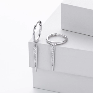 Close-up of S925 silver hoop earrings with micro-paved cubic zirconia tapered pendants