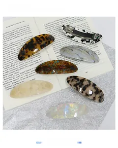 Set of 6 textured acetate geometric hair clips in leopard, marble, and pearl finishes