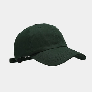 Detail showing high-quality cotton twill fabric and stitching on dark green baseball cap