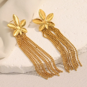 Detail of 18K gold plated stainless steel flower earrings with long metal tassel chains