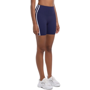 Detail view of navy blue high-waisted yoga shorts with side white stripes and stitching