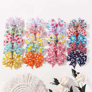 20-piece set of girls' grosgrain ribbon flower and fruit print hair clips in a grid layout