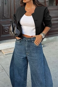 Close-up of black crew neck vest jacket with button details and casual styling
