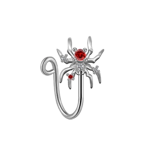 Detail of silver spider non-piercing nose ring clip with red and white gemstones