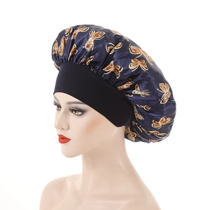 Elastic satin bonnet cap with gold butterfly print on navy blue and black wide band