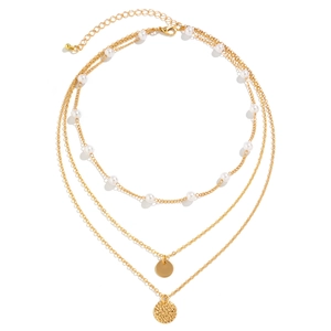 Detailed view of triple-layered golden necklace with pearls and textured round pendants