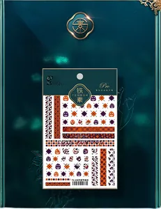 Detail view of 5D Halloween nail stickers with orange pumpkin and purple stripe patterns