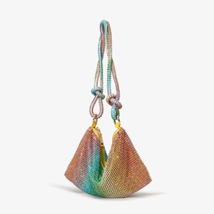 Close-up of rainbow rhinestone mesh evening bag with knotted handle and gradient colors
