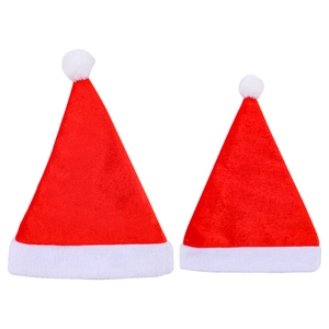 Classic red plush Christmas hats for adults and kids with white fur trim and fluffy pom-poms
