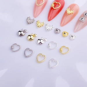 Golden and silver hollow heart metal nail art charms in a professional layout