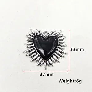 Gothic silver heart pendant with black enamel wings showing 37mm width and 33mm height