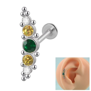 Macro detail of curved 16g steel labret with colorful multi-gemstone clusters