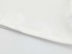 Detail view showing professional double-needle stitching on the white modal t-shirt hem
