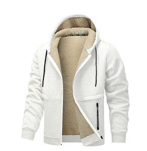 Detail of warm sherpa lining and decorative black zipper pocket on a white jacket