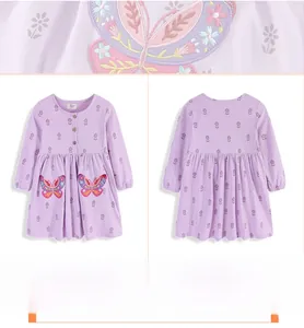 Detail of floral purple cotton dress featuring butterfly embroidery and soft knit texture