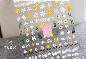 Gros plan de stickers nail art 5D marguerites avec motifs floraux mats et feuilles vertes