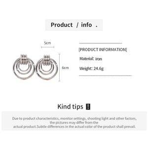 Macro view of geometric triple-hoop iron earrings with dimensions and weight specs