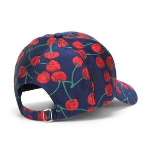 Detailed back view of a navy baseball cap with cherry embroidery and metal buckle