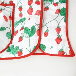 Chic quilted cotton jacket for women featuring elegant strawberry prints and red piping