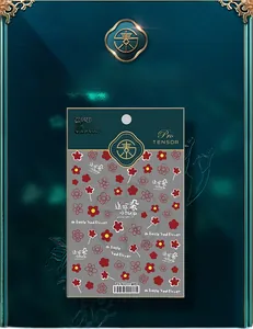 Detail of 5D red and pink flower nail stickers with floral patterns on a dark backdrop