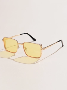 Detail of vintage square gold metal frame sunglasses with yellow lenses and nose pads
