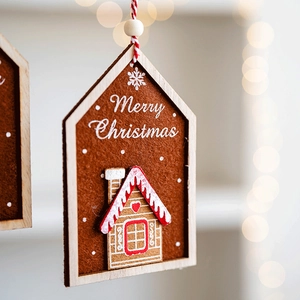 Wooden gingerbread house ornament with felt details and Merry Christmas text for tree decor