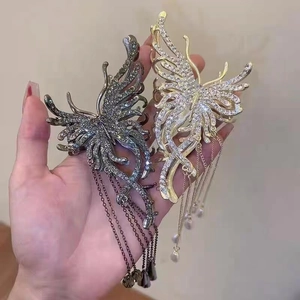 Elegant butterfly hair claw clips with rhinestones and pearl tassel fringe details