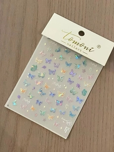 Macro shot of TO 2962 holographic butterfly nail stickers with aurora shimmer effects