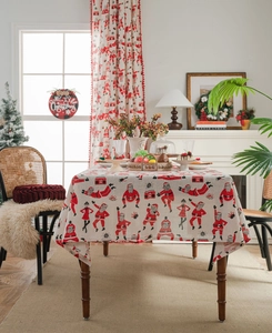 Detail of Christmas Santa print on linen tablecloth with festive home decor background