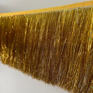 Macro shot of 20cm metallic gold tassel trim with high-shine fringe for costumes