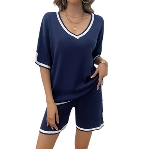 Women's 2-piece navy knit lounge set with white stripe trim on V-neck top and shorts