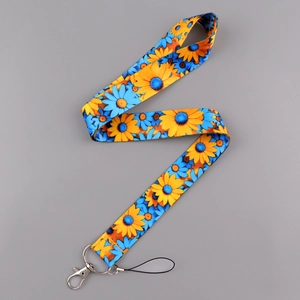 Detail of floral lanyard with sunflower print, metal lobster clasp and phone strap