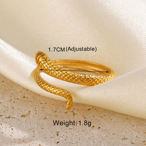 Detail of adjustable golden snake ring on white silk with size and weight info