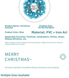 Close-up of blue Christmas wreath with silver ornaments and Merry Christmas sign