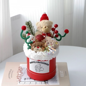 Christmas gift box with plush teddy bear, reindeer, and snowman dolls in a red cylinder