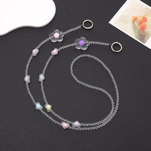 Beaded crossbody phone strap with colorful acrylic hearts and flowers on black background