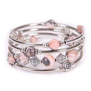 Detail of layered wrap bracelet with pink and grey natural stones and silver beads