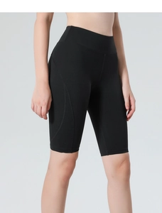 Close-up of black high-waisted biker shorts with ergonomic curved seam stitching