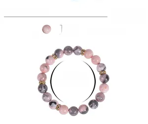Detail view of 10mm pink zebra stone beads with gold spacers and elastic cord parameters