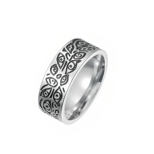Detailed view of titanium steel ring with unique engraved all-seeing eye pattern