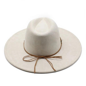 Detail of off-white wide brim fedora with brown leather band and delicate bow accent