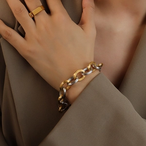 Chic two-tone 18K gold plated chain link bracelet for women on a model's wrist