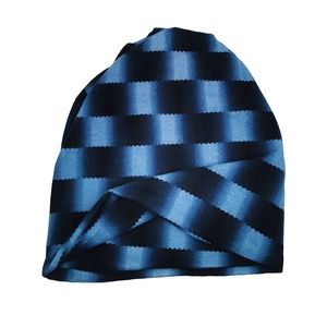 Blue and black striped slouchy beanie hat with cross-front design in knit fabric