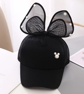 Close-up of girl's sun hat with mesh bow and pearl Mickey silhouette decoration