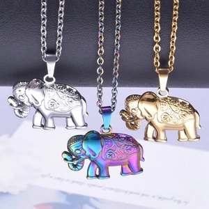 Three elephant pendant necklaces in gold, silver, and rainbow stainless steel finishes